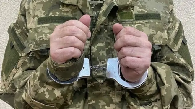 Handout photo by Ukraine's security service SBU purportedly showing Viktor Medvedchuk in handcuffs