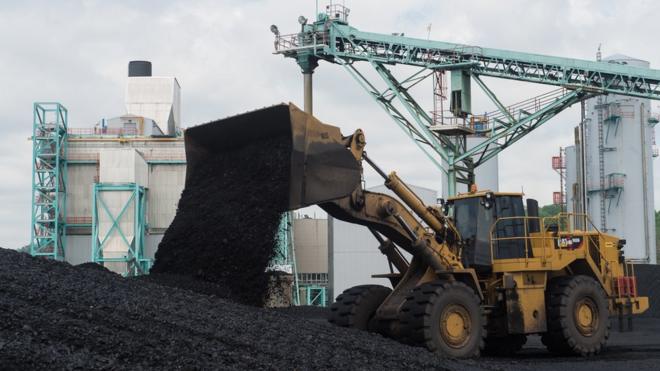 A front-end loader dumps coal at the East Kentucky Power Cooperative's John Sherman Cooper power station near Somerset, Kentucky, (April 19, 2017)