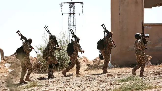 Бойцы опозиционных сил в районе провинции Идлиб