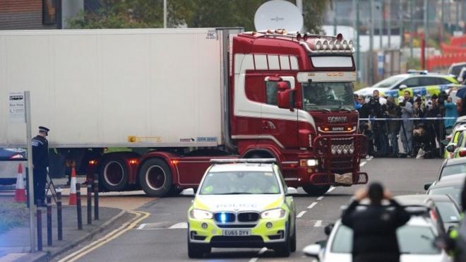 Lorry container being moved under police escort