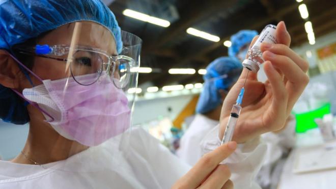 Medical workers prepare the Astra Zeneca vaccine, as the authority starts its mass vaccination programs, following a surge of domestic cases and deaths related to the Coronavirus, in New Taipei, Taiwan, on 15 June 2021.