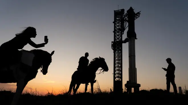 People view the rocket on the launchpad