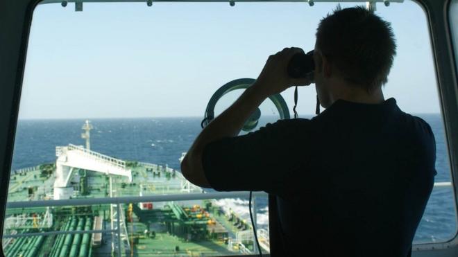 Keeping watch: a British security guard on the bridge of a merchant tanker off the coast of Oman during the height of the Somali piracy threat. Photo: Frank Gardner