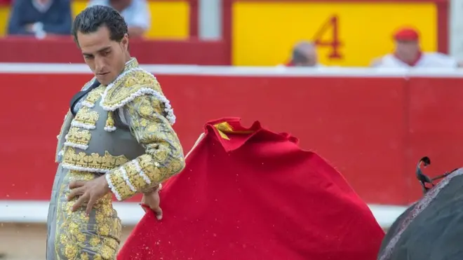 Spanish bullfighter Ivan Fandino as he fights a bull in a bullfight in the Fiesta de San FermÃn in Pamplona, northern Spain, 10 July 2015