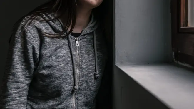 Sad and contemplative young woman.