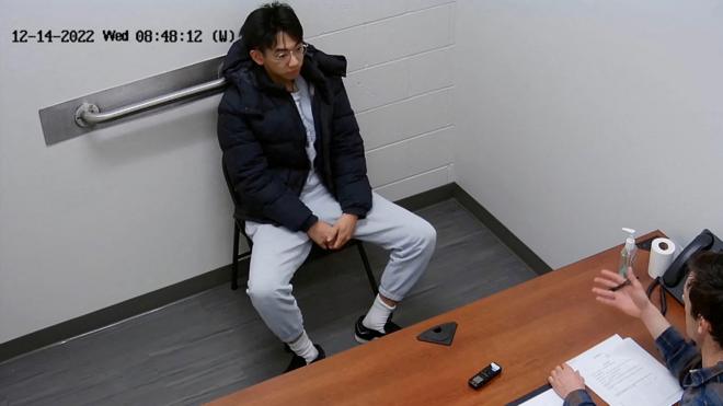 Xiaolei Wu, a citizen of China who at the time was a student at the Berklee College of Music in Boston, sits for an interview with the Federal Bureau of Investigation at its office in Chelsea, Massachusetts, December 14, 2022 in a still image from video. U.S. Attorney’s Office for the District of Massachusetts/Handout via REUTERS.