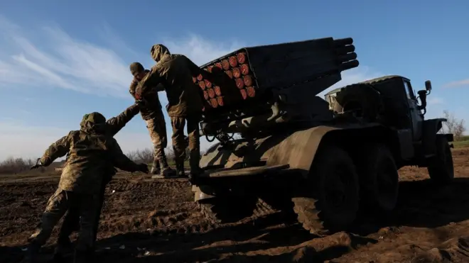 This file photo shows Ukrainian troops operating a multiple rocket launcher last week