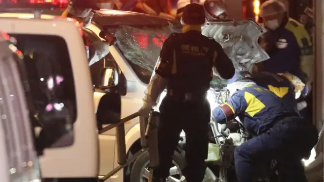 Policemen stand next to a car which ploughed into pedestrians on New Year day in Tokyo, Japan, January 1, 2019.