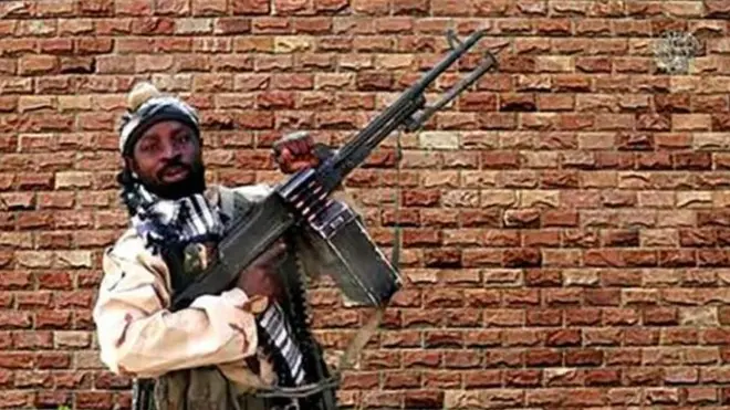 Abubakar Shekau carry gun