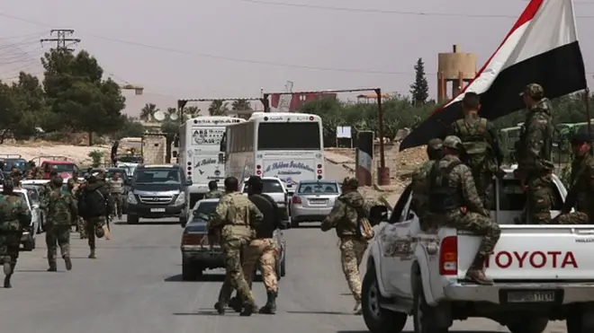 Unconfirmed reports say the bus was carrying Syrian government soldiers when it was ambushed