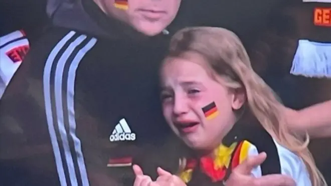 The little girl was filmed crying at the German football team's loss at the Euros