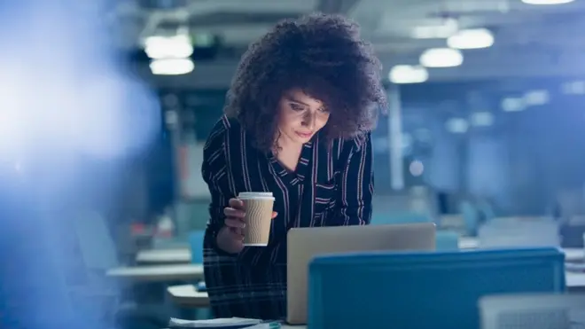 Woman drinking coffee (c) Science Photo Library