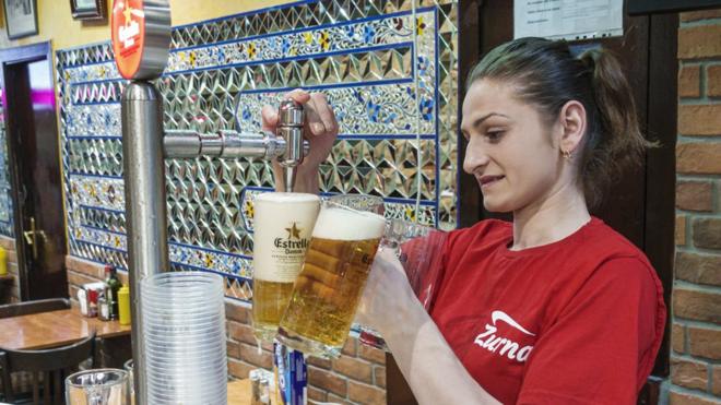Bartender pouring beer from tap in Barcelona (file image)