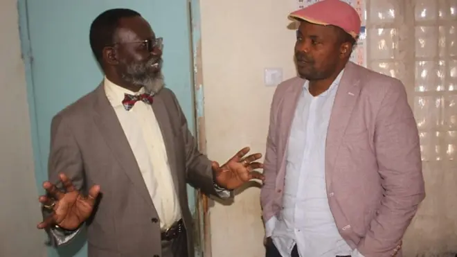 Godbless Lema akiwa na wakili wake