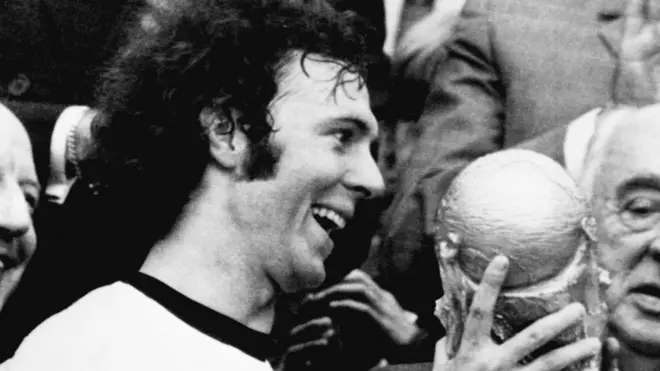 Franz Beckenbauer holds the World Cup trophy