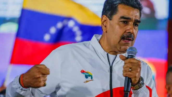 Venezuela's President Nicolas Maduro addresses supporters at a rally on the day of the referendum
