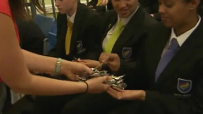 Teacher hands out spoons