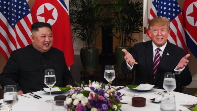 US President Donald Trump (R) and North Korea"s leader Kim Jong Un sit for a dinner at the Sofitel Legend Metropole hotel in Hanoi on February 27, 2019.