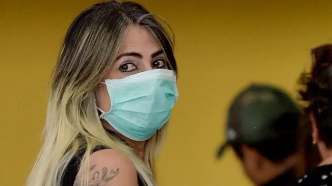 A woman wearing a face mask