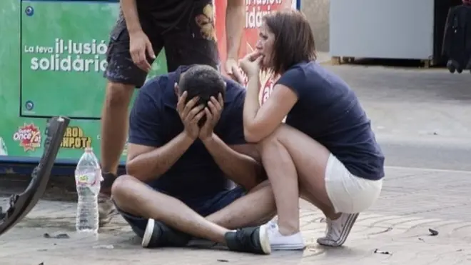people react after a van crashed into pedestrians in Las Ramblas, Barcelona, 17 August 2017