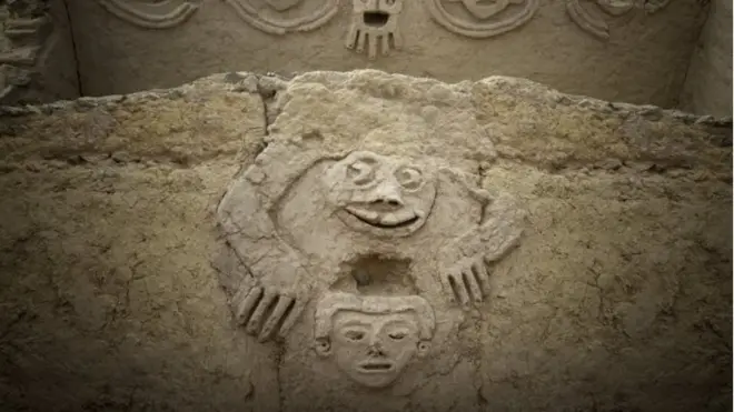 An undated handout photo made available by Archaeological Area Caral shows a humanized toad and an anthropomorphic head, discovered in one of the buildings of the civilization of Caral, north of Lima