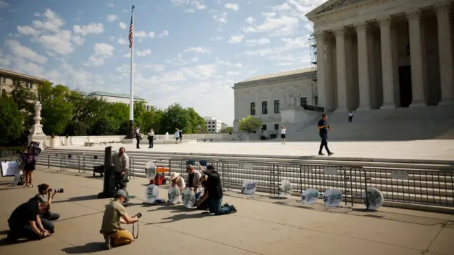 Protesters gather outside the Supreme Court
