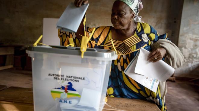 A woman from Central African Republic (CAR) casts her ballot in the presidential and legislative elections at the Lycee Boganda polling station in Bangui, Central African Republic, 27 December 2020.