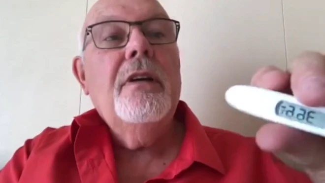 David Abel takes holding a thermometre