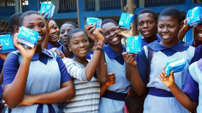 School girls wey hold pads.