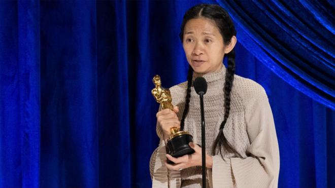 Chloe Zhao with her Oscar for best director