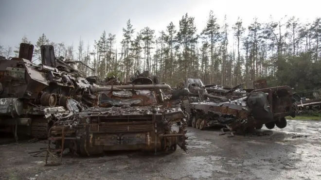 Destroyed vehicles remain in the city of Lyman after Russian troops were forced out.