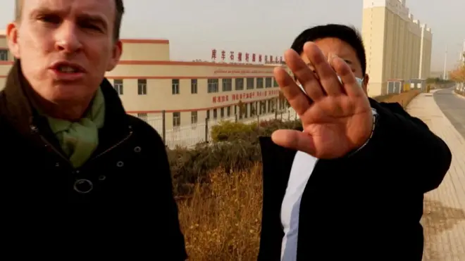 The BBC's John Sudworth (left) was repeatedly followed and prevented from filming