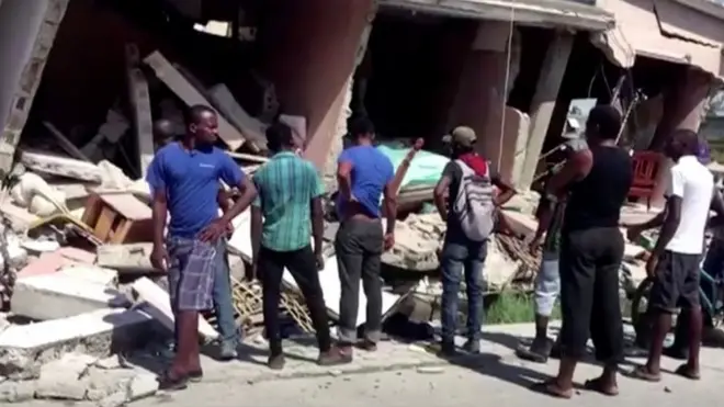 A number of buildings in Les Cayes are destroyed
