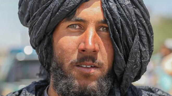 A Taliban fighter poses for a photograph in Kabul, Afghanistan, 16 August 2021