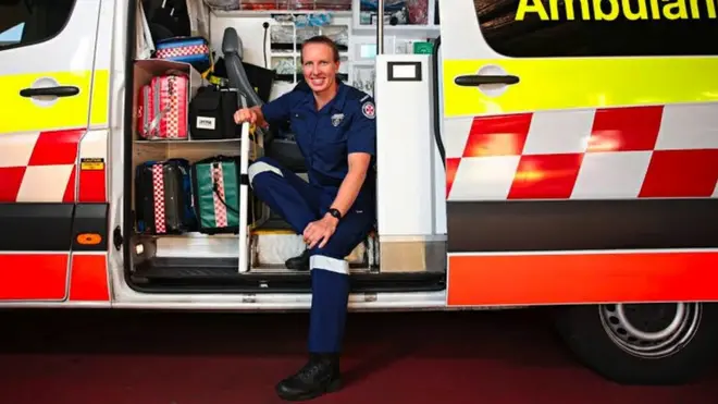 Jo sat in her ambulance