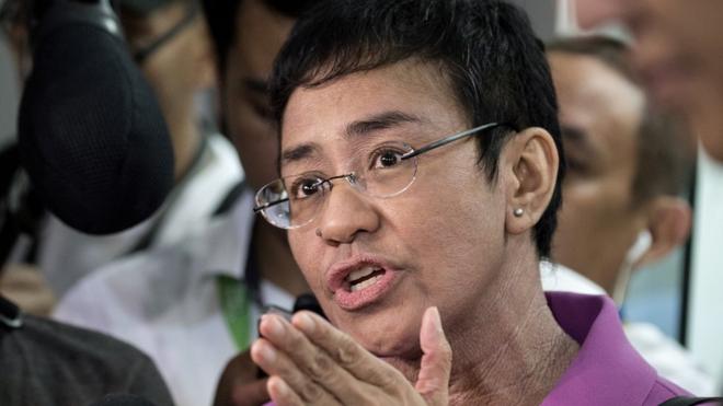 CEO of Philippine news website Rappler, Maria Ressa, gestures as she speaks to the media