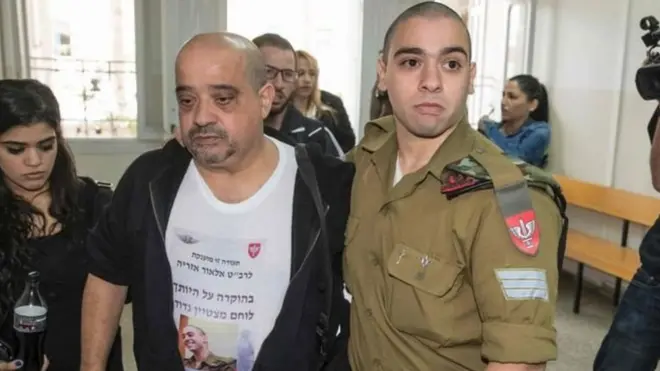 سارجنٹ ایلور ایزرایا( دائیں جانب) کو سزا ملنے کے بارے میں منقسم رائے پائی جاتی ہے