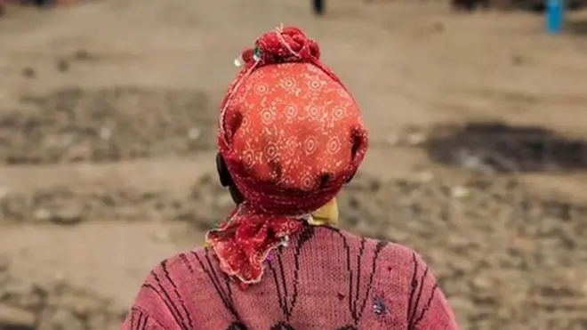 A woman crosses the Mweso market, Masisi Territory, eastern Democratic Republic of the Congo