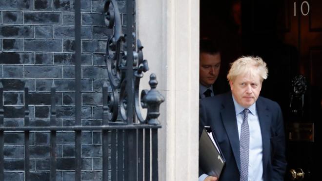 Boris Johnson leaves Downing Street on 19 October