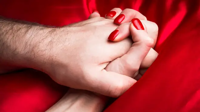 Clenched hands - man and woman