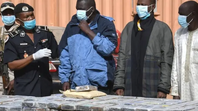 The seized cocaine is seen on a table at the premises of the Central Office for the Repression of Illicit Drug Trafficking in Niamey, 5 January 2022