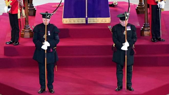 Ben Wallace and Alistair Jack guarding the Queen's coffin in dark uniforms