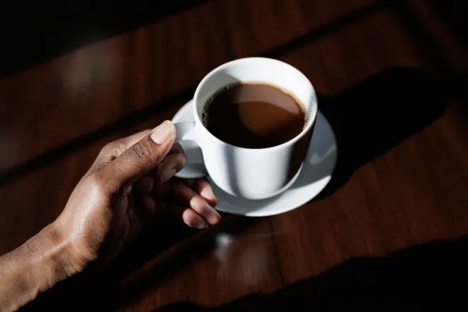 Woman hold cup of coffee