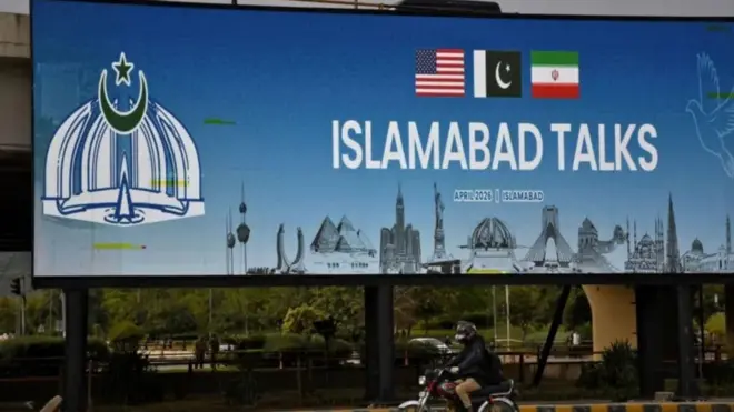 One big billboard wit di logo of US, Iran and Pakistan