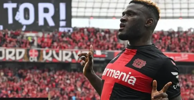 Footballer wey dey celebrate goal