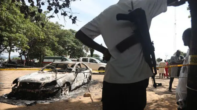 Photo of security man wey stand near one location wey bandits attack