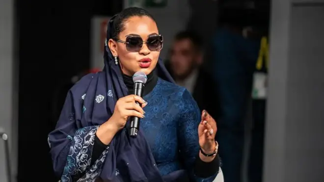 Natasha Akpoti speaking with a mic