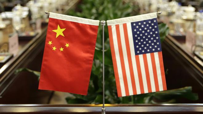 Flags of the US and China are placed ahead of a meeting between US Secretary of Agriculture Sonny Perdue and China's Agriculture Minister Han Changfu at the Ministry of Agriculture in Beijing on June 30, 2017.