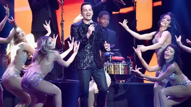 Victor Manuelle, shown performing Amarte Duro at the recent Billboard Latin Music Awards, has rebuffed claims he has disrespected Medellín's bloody past with the song