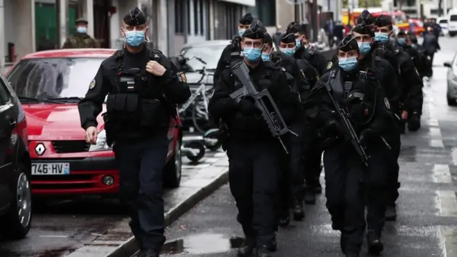 Security was tight as police combed the scene of the attack near the Boulevard Richard-Lenoir
